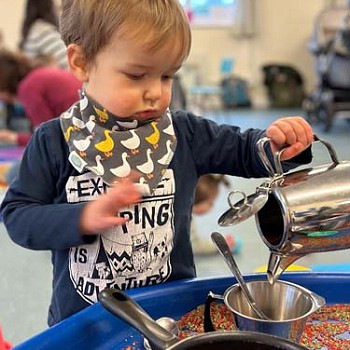 child playing with water