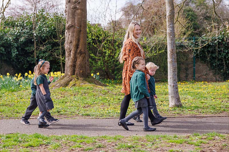 teacher taking students for a walk